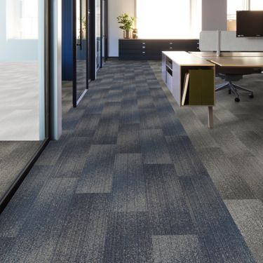 Interface Light Play carpet tile in open workspace area with seating