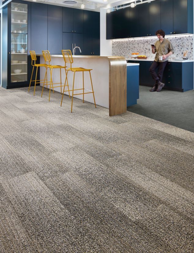 Interface Effervescent plank carpet tile with norament arago rubber flooring in corporate break area