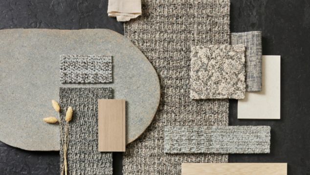 Tabletop palette of Interface Etched & Threaded carpet tiles with Earthen Forms LVT and norament arago rubber