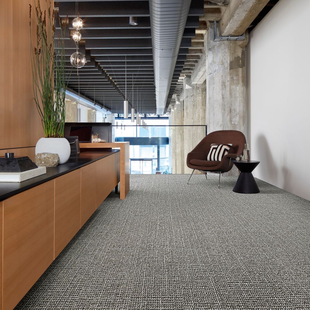 Interface E613 plank carpet tile in office corridor with credenza and small seating area