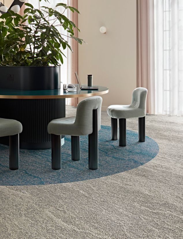 Interface Free Reign plank carpet tile in workplace seating area with large plants