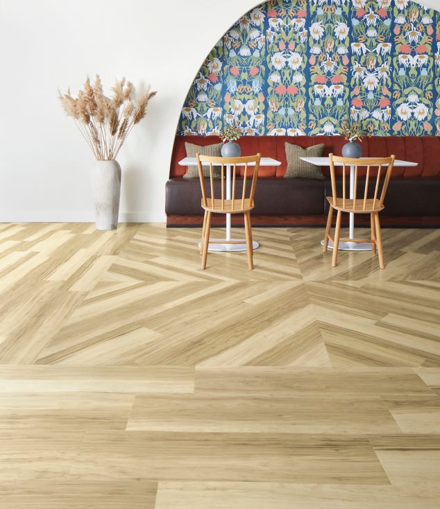 Interface Great Heights LVT in Douglas Fir shown in a casual seating area