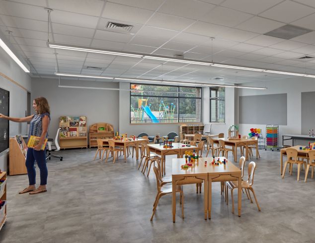 Interface Textured Stones LVT in classroom with teacher at board