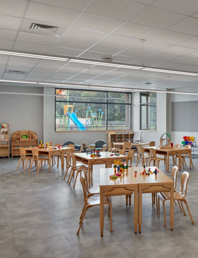 Interface Textured Stones LVT in classroom with teacher at board