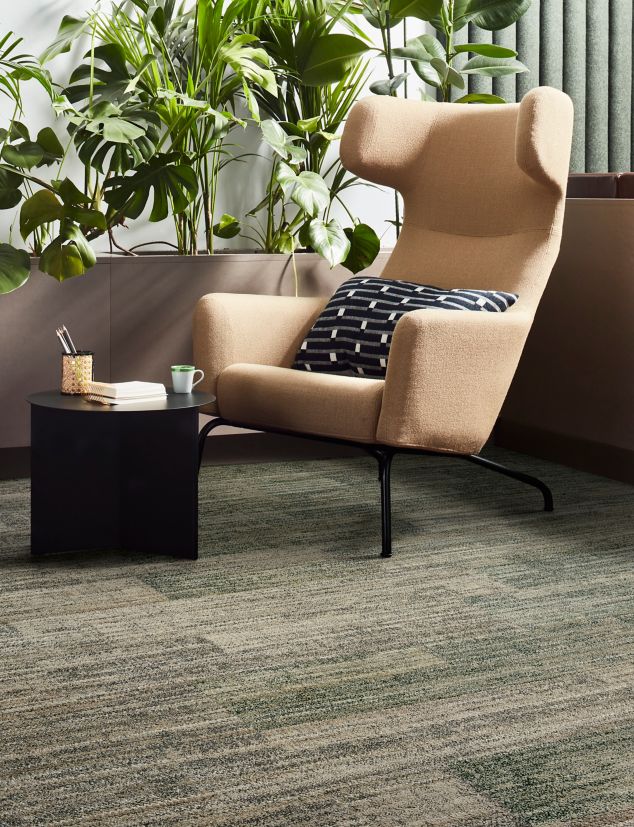 Interface Fringe Benefits plank carpet tile in seating area with several plants