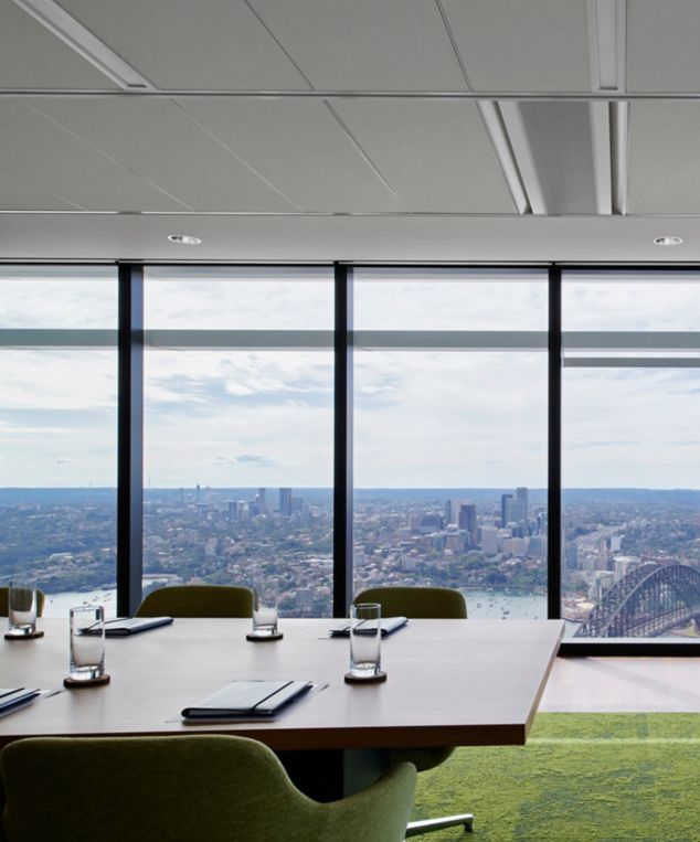 Interface UR103 carpet tile with Custom Teak plank LVT in workplace meeting room