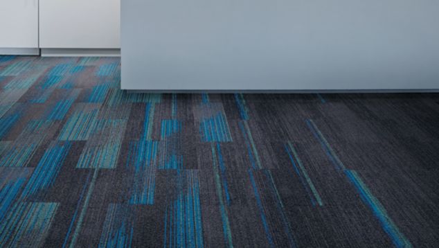 Interface Ground Waves, Ground Waves Verse and Harmonize plank carpet tile in office with large white counter