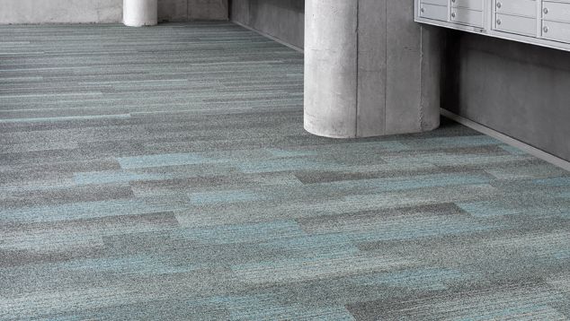 Interface Harmonize, Ground Waves and Ground Waves Verse plank carpet tile in lobby area with mailboxes