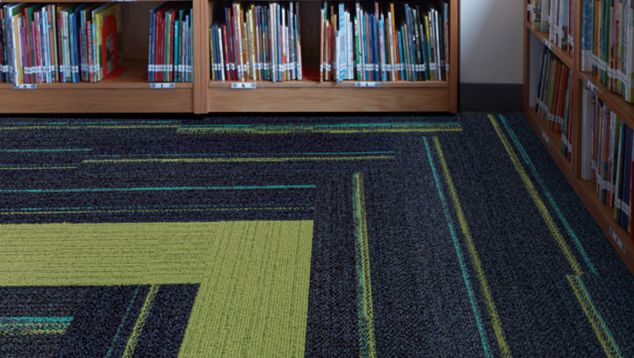 Interface Ground Waves and On Line plank carpet tile in corner of elementary school library