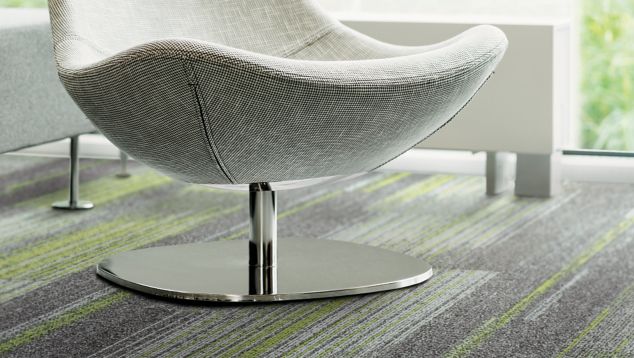 Detail of Interface Ground Waves and Ground Waves Verse plank carpet tile with white chair
