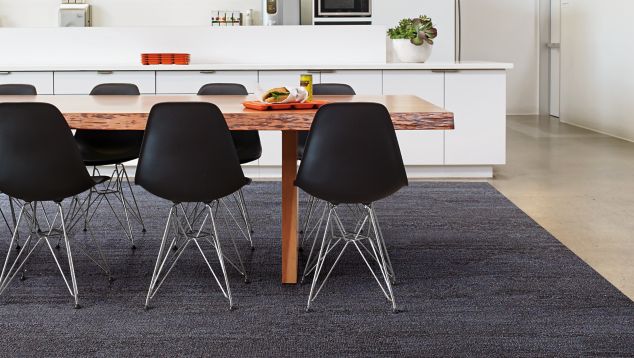 Interface HN820 plank carpet tile in open kitchen with live edge wood table
