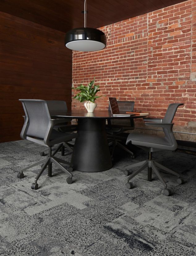Interface HR Blends carpet tile in collaborative space with exposed brick wall