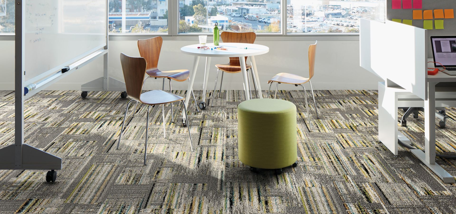 Interface Hard Drive plank carpet tile in collobaration space with whiteboard and small cubicle