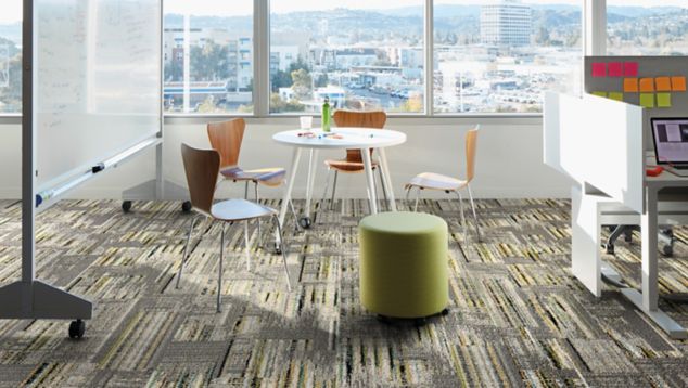 Interface Hard Drive plank carpet tile in collobaration space with whiteboard and small cubicle