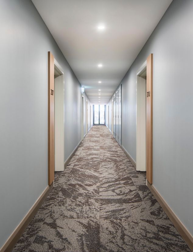 Interface Hard Truth carpet tile in corridor