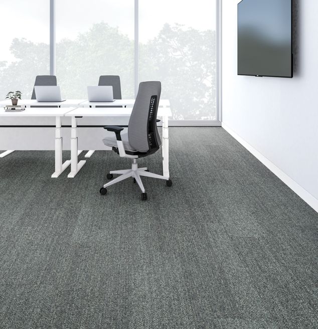 Interface Harmonize plank carpet tiles in empty meeting room with white desks and heathered grey office chairs