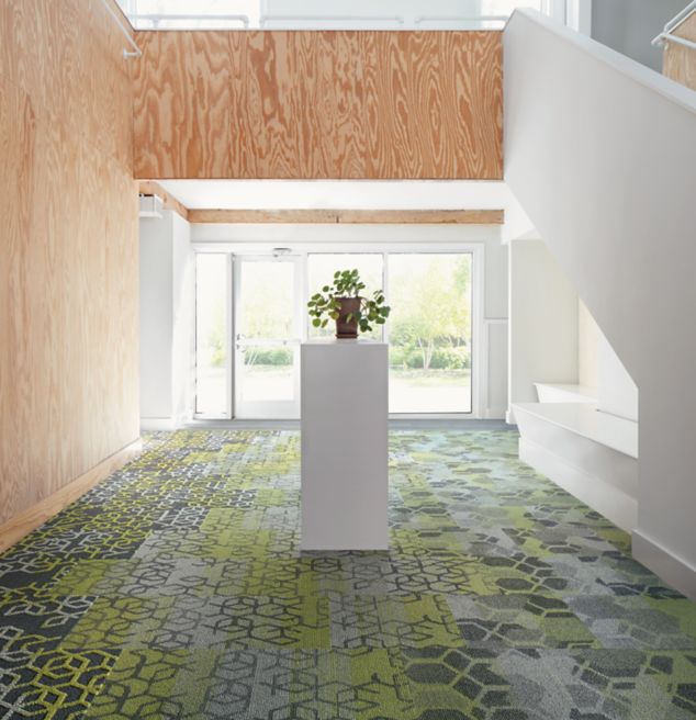 Interface Bee's Knees carpet tile and LVT in entryway with plant on stand