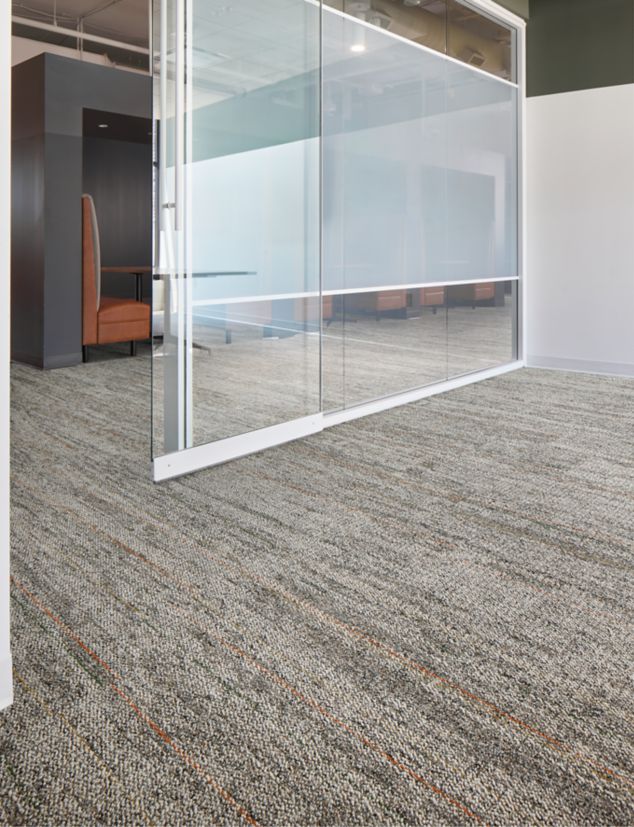 Interface Open Air 402 Stria carpet tile in office corridor under glass door