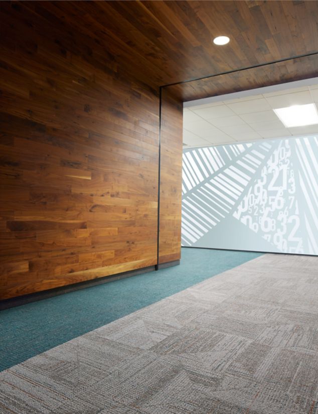 Open Air Stria 403 and Open Ended carpet tile in office corridor setting with glass and wood wall