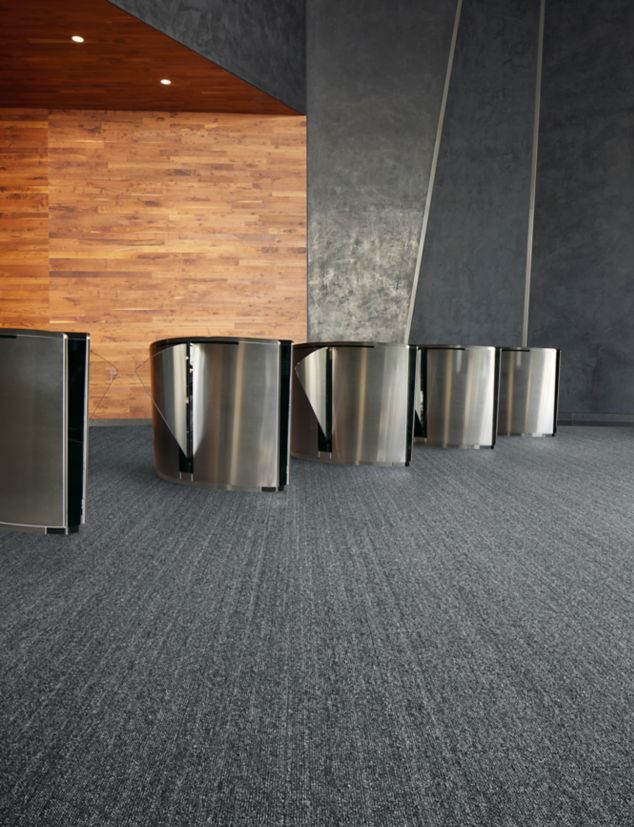 Interface WW860 carpet tile in auditorium entryway with turnstiles