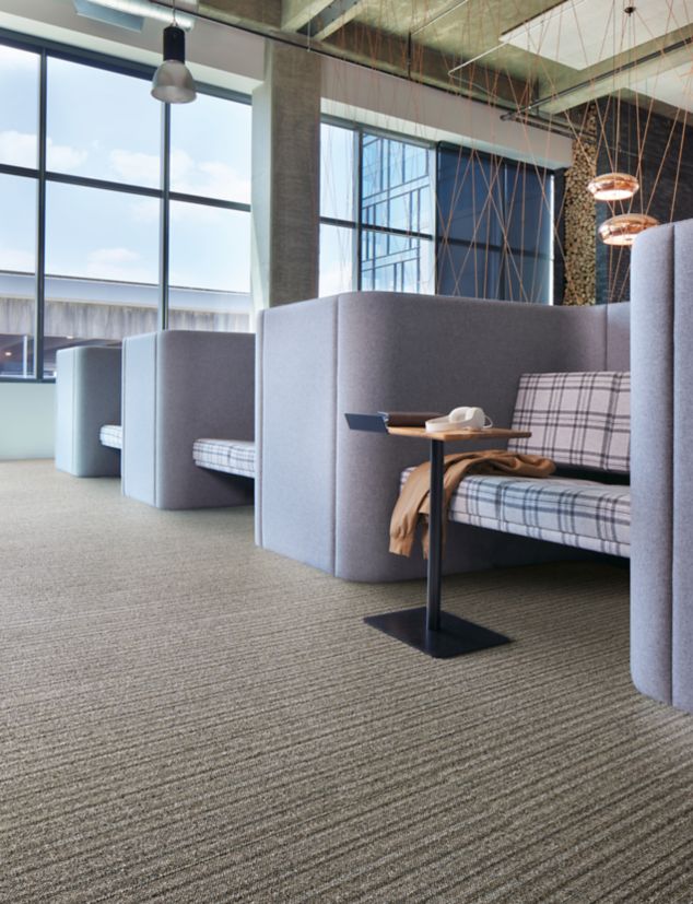 Interface WW865 plank carpet tile with chairs and table in modern office setting