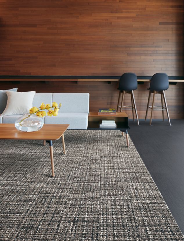 Interface WW895 and Shantung carpet tile in lobby area with table, sofa, and bar