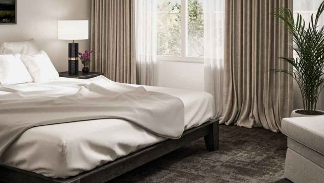 Interface Cloud Cover carpet tile in hotel guest room with platform bed