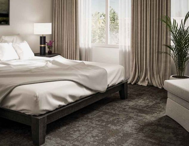 Interface Cloud Cover carpet tile in hotel guest room with platform bed