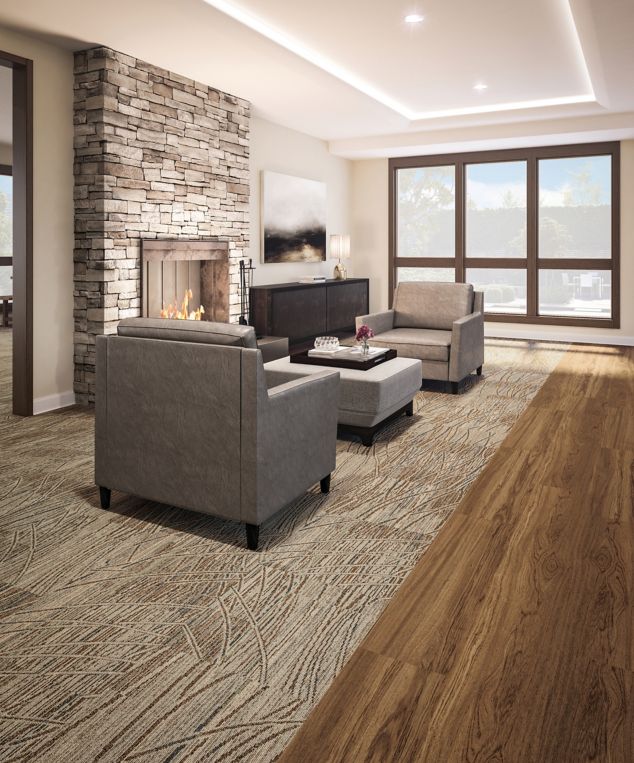 Interface Prairie Grass carpet tile inset into Natural Woodgrains LVT in senior housing lounge area