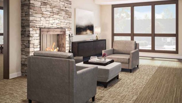 Interface WE153 and WW880 plank carpet tile in seating area with fire place