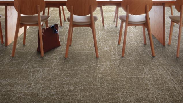 Interface Ice Breaker carpet tile in seating area with wooden chairs and table