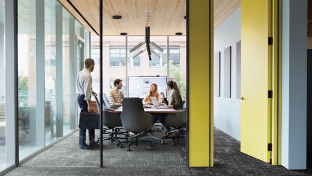 Interface Ice Breaker carpet tile in meeting room with four people