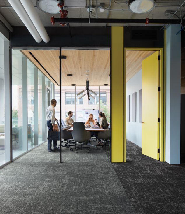 Interface Ice Breaker carpet tile in meeting room with four people