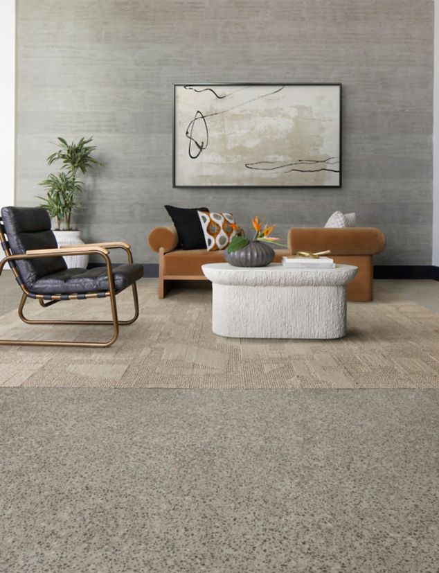 Interface In the Mix LVT in Keystone and E612 plank carpet tile in Wheat in a lobby.