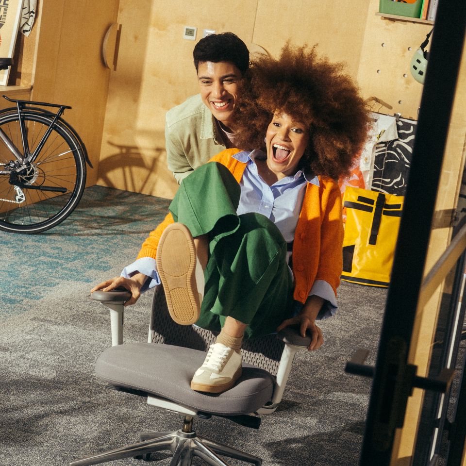 Interface Open Air 404 and Open Air 404 Transition carpet tile in office with man pushing woman in office chair