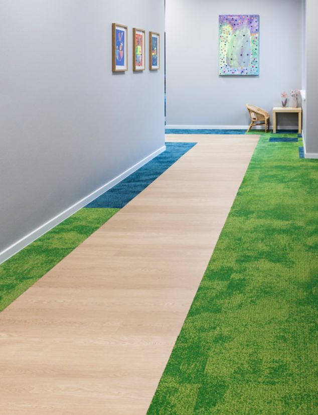 Interface Northern Grain LVT with Composure carpet tile in elementary school corridor