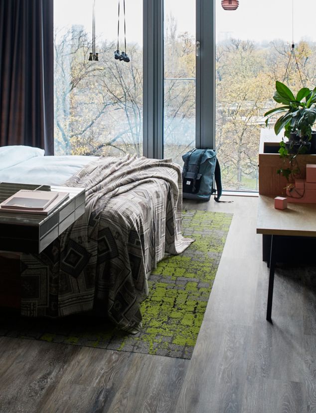 Interface Level Set LVT and Human Connections carpet tile in bedroom