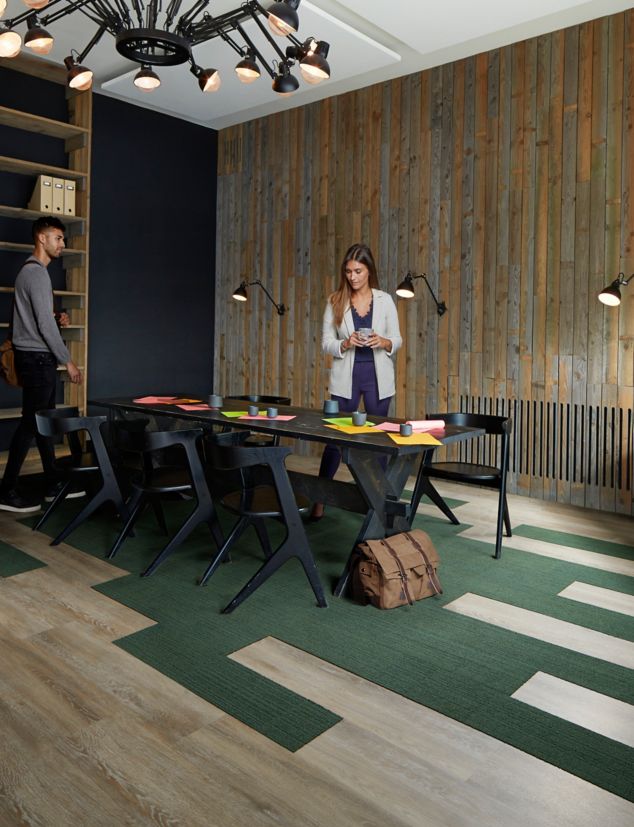 Interface Textured Woodgrains LVT and On Line carpet tile in a conference setting with table and chairs 