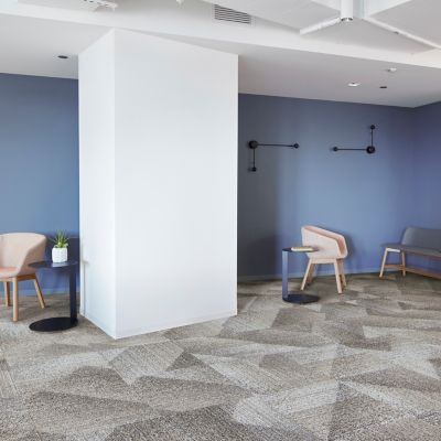 Interface Light Play carpet tile in open workspace area with seating