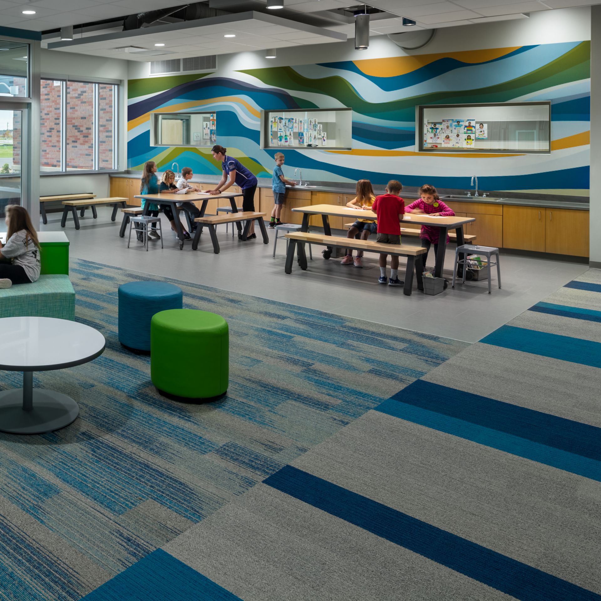 Interface Ground Waves Verse, Harmonize and On Line plank carpet tile with nora valua rubber flooring in K-12 open classroom