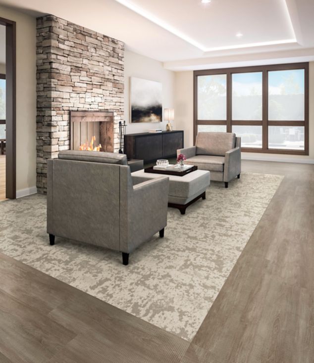 Interface Meadowland carpet tile in seating area for two with fireplace in brick wall