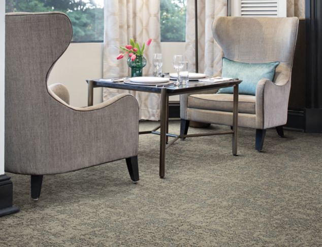 Interface Meadowland carpet tile in seating area for two with flowers on table