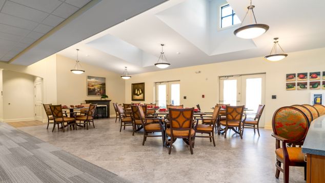 Interface Shiver Me Timbers plank carpet tile with Natural Stones square LVT in senior housing dining area