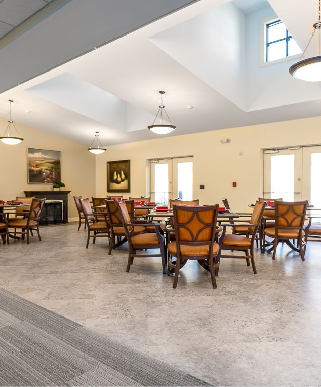 Interface Shiver Me Timbers plank carpet tile with Natural Stones square LVT in senior housing dining area