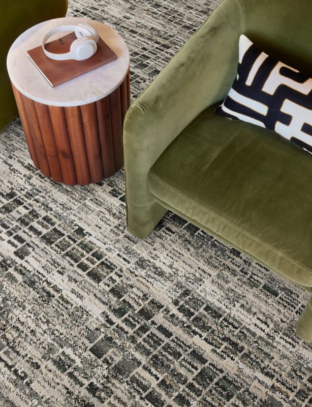 Interface Reflective Sky plank carpet tile in close-up of seating area