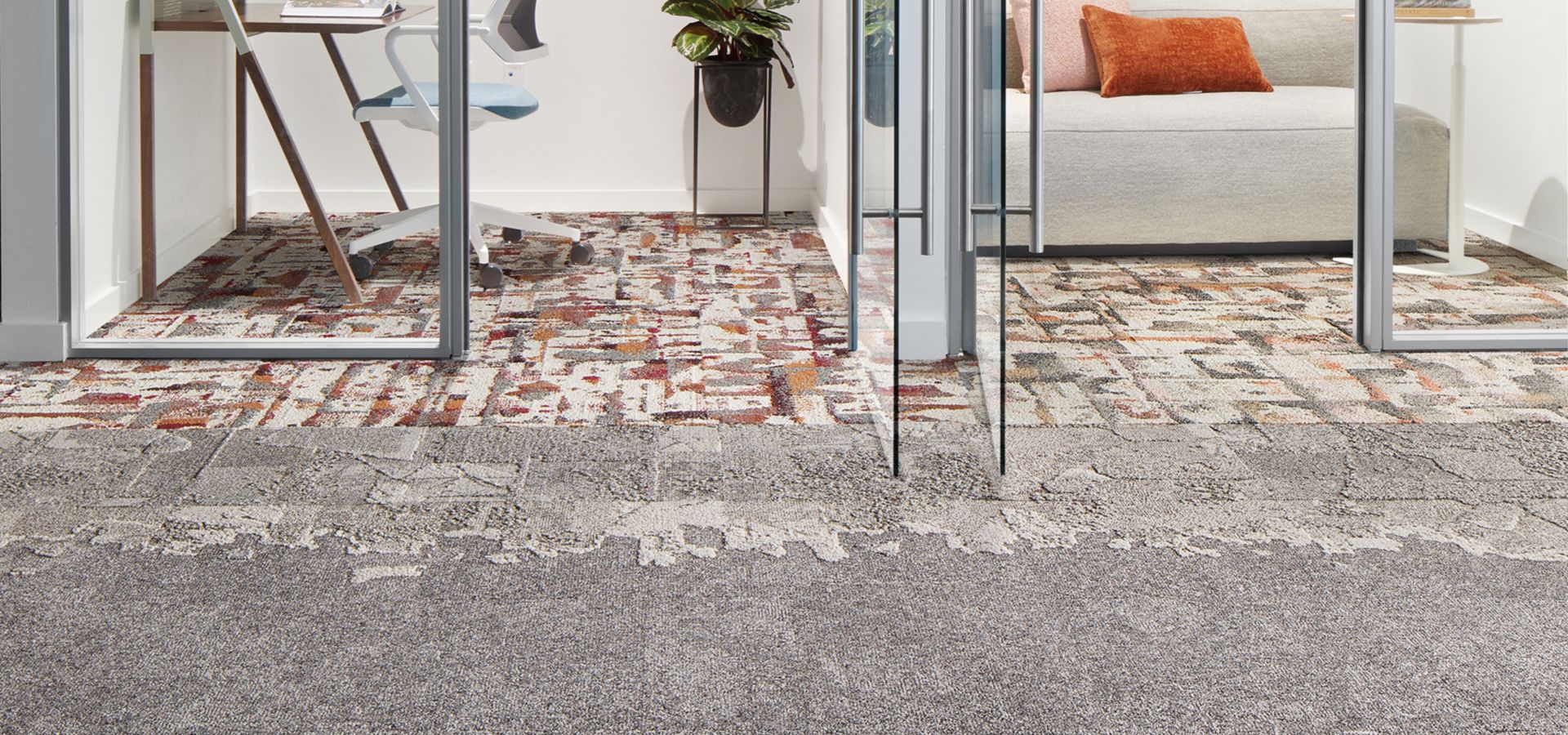 Interface Bridge Creek, Mountain Rock, Flat Rock and Panola Mountain carpet tile in office with glass-enclosed meeting spaces