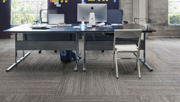 Interface NF400 plank carpet tile with a workstation