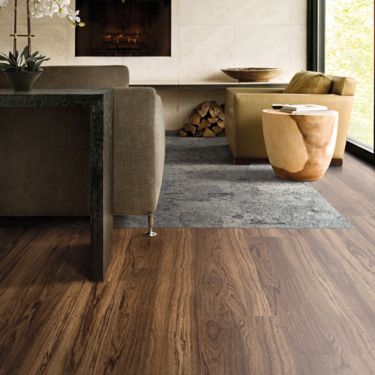 Interface Natural Woodgrains LVT in lobby with UR102 plank carpet tile as inset area rug