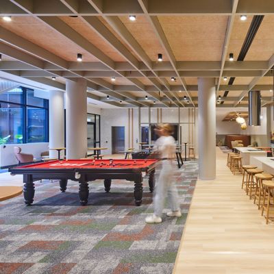Interface Natural Woodgrains LVT with Open Air 403 and Open Air 403 Transition carpet tiles in multiresidential recreation area
