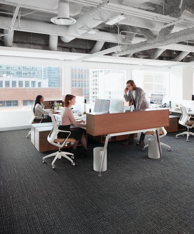 Interface Night Flight carpet tile in open office with people working at desks